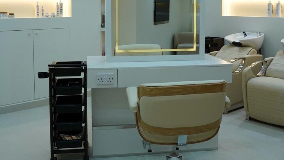 Styling station and hair-wash chairs in the salon